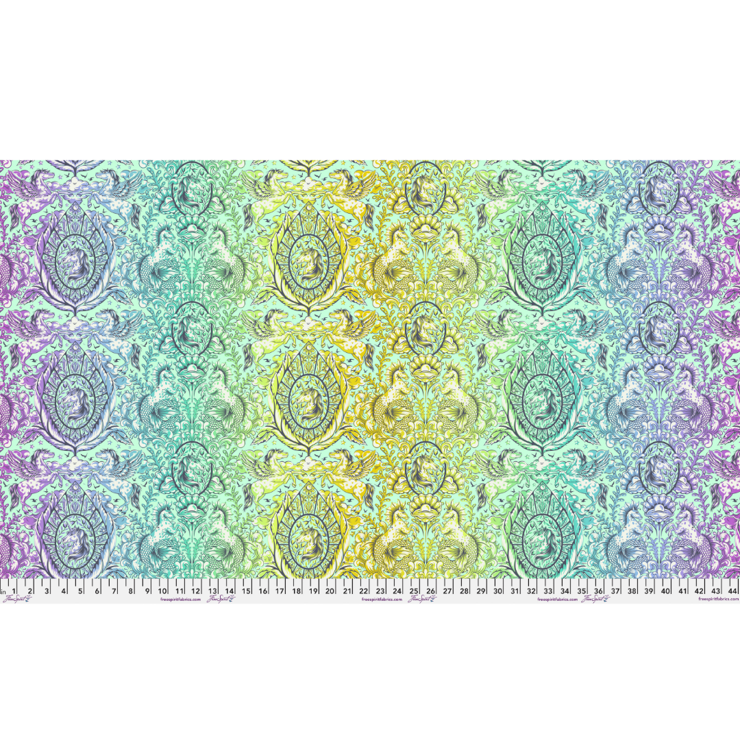 Decorative fabric with a colorful pattern on a white background with ruler for scale
