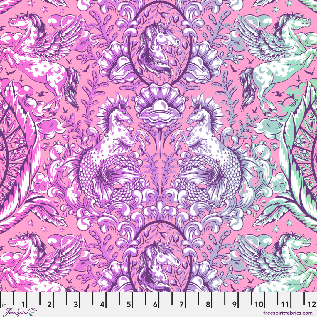 Colorful fabric pattern with mermaids and sea creatures on a pink background