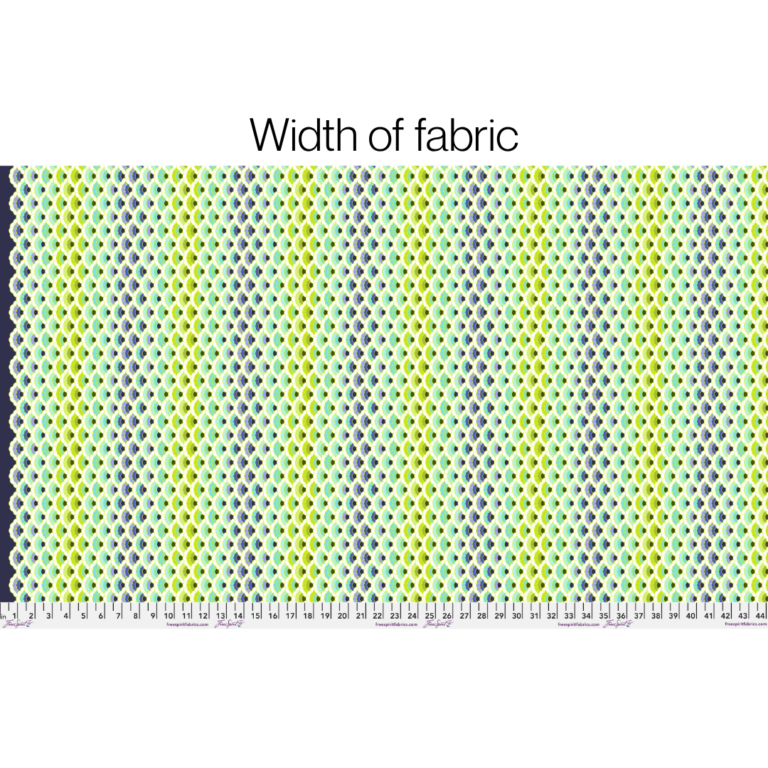 Fabric swatch with a pattern and a ruler at the bottom for width measurement.