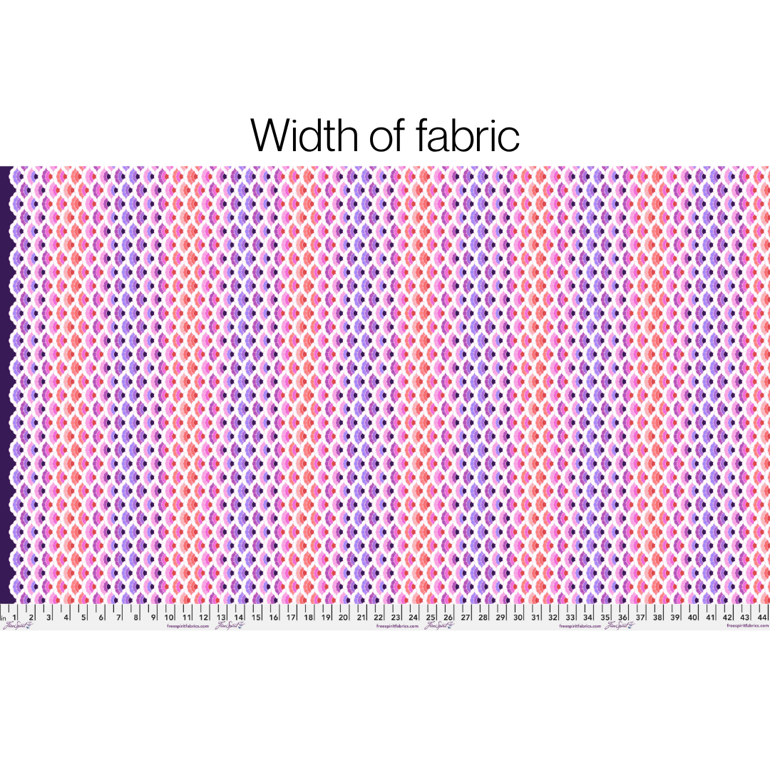 Fabric with a pattern and a ruler at the bottom for scale on a white background