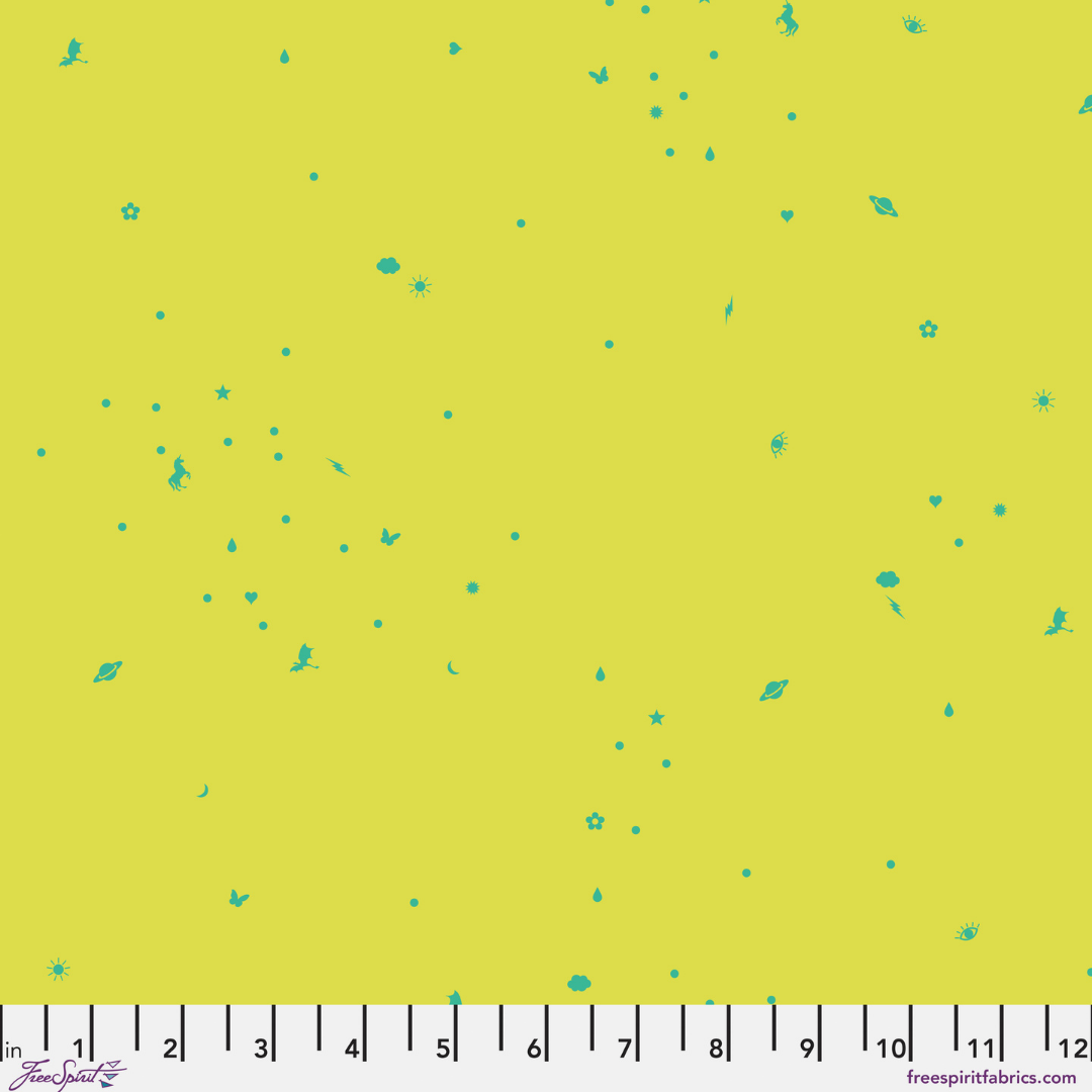 Fabric swatch with small green floral patterns on a yellow background with a ruler at the bottom
