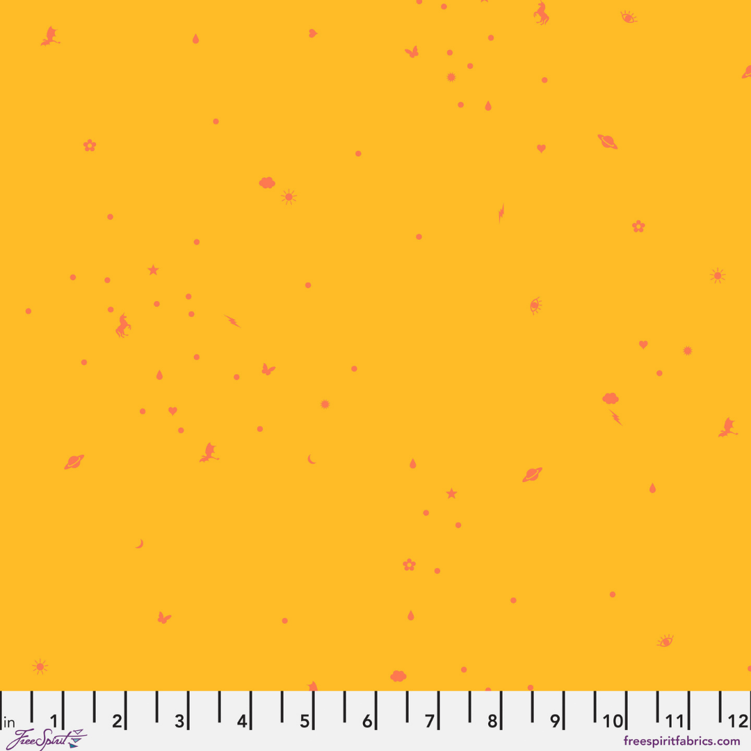 fabric swatch with a sunny little tossed charm print with tiny coral-pink icons scattered across a golden yellow background with a ruler at the bottom