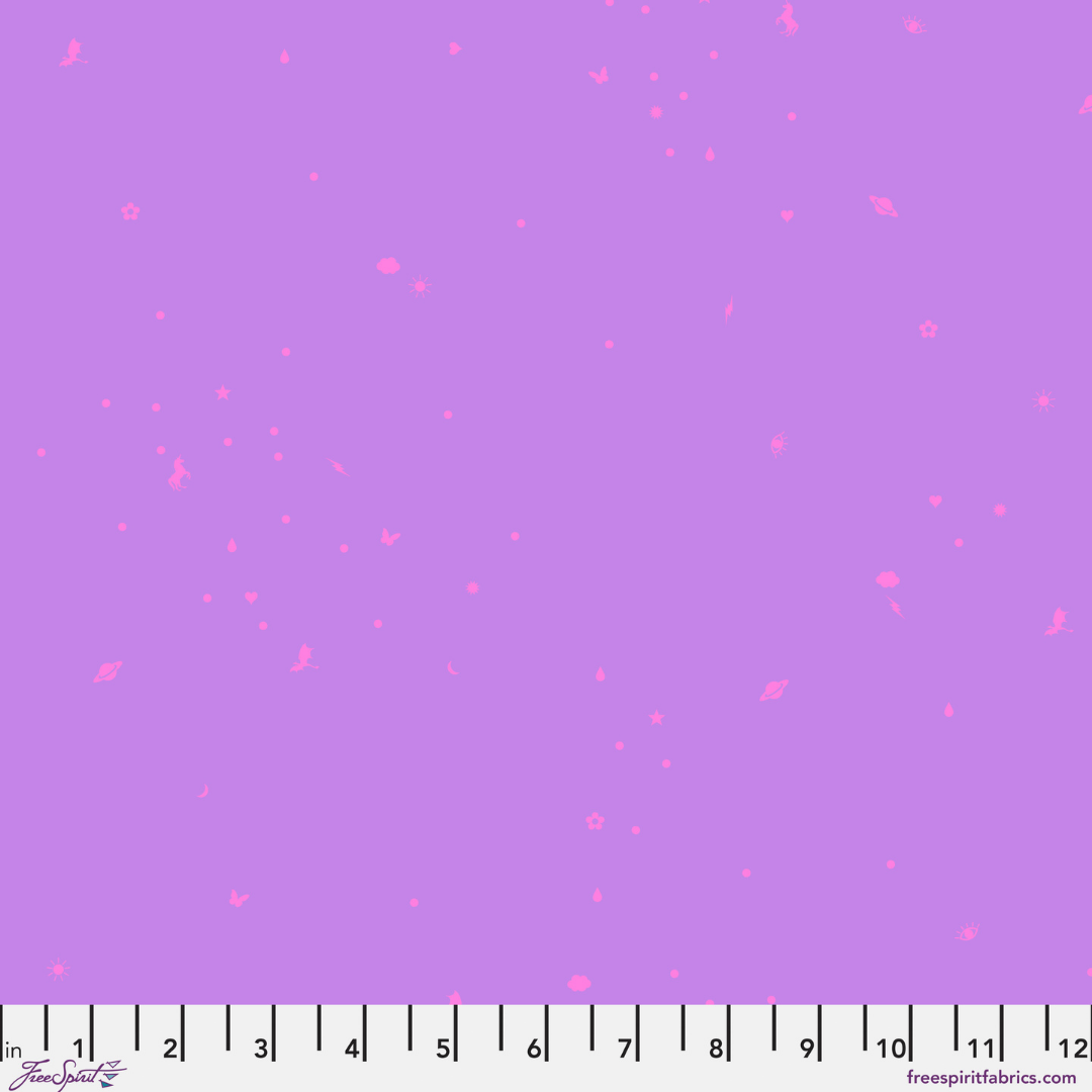 Purple fabric with pink heart pattern and a ruler at the bottom