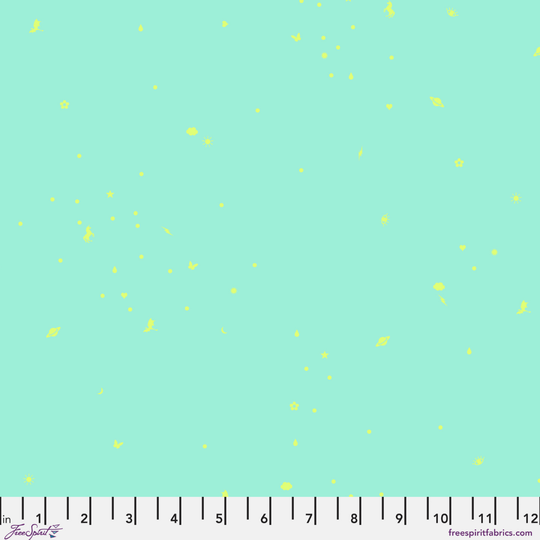Pattern of small yellow dots on a light blue background with a ruler at the bottom.