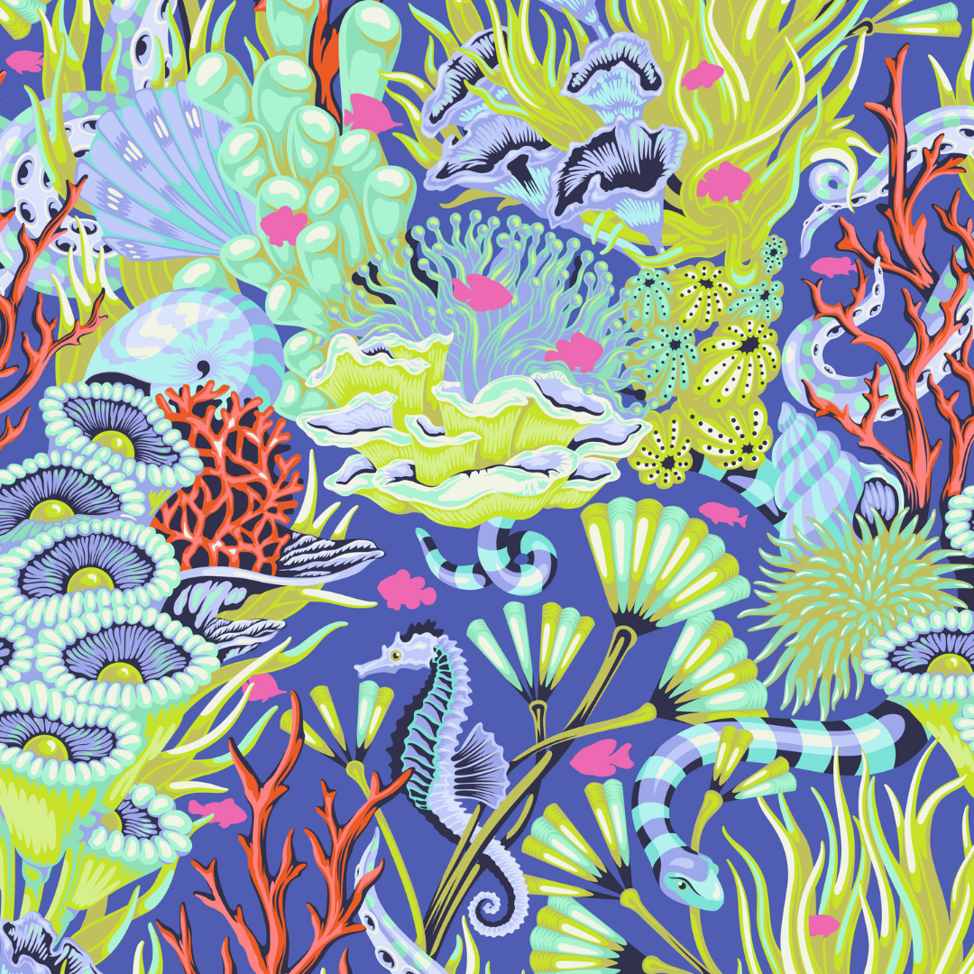 Fabric swatch with a lush underwater print filled with coral, sea plants, shells, seahorses, and other ocean details on a rich marine blue background.