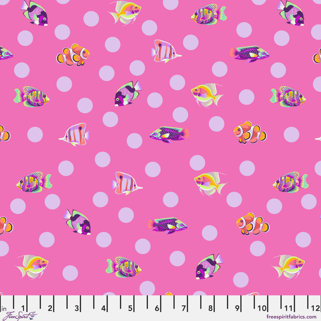 colorful fish on a pink ground with white dots with a ruler at the bottom