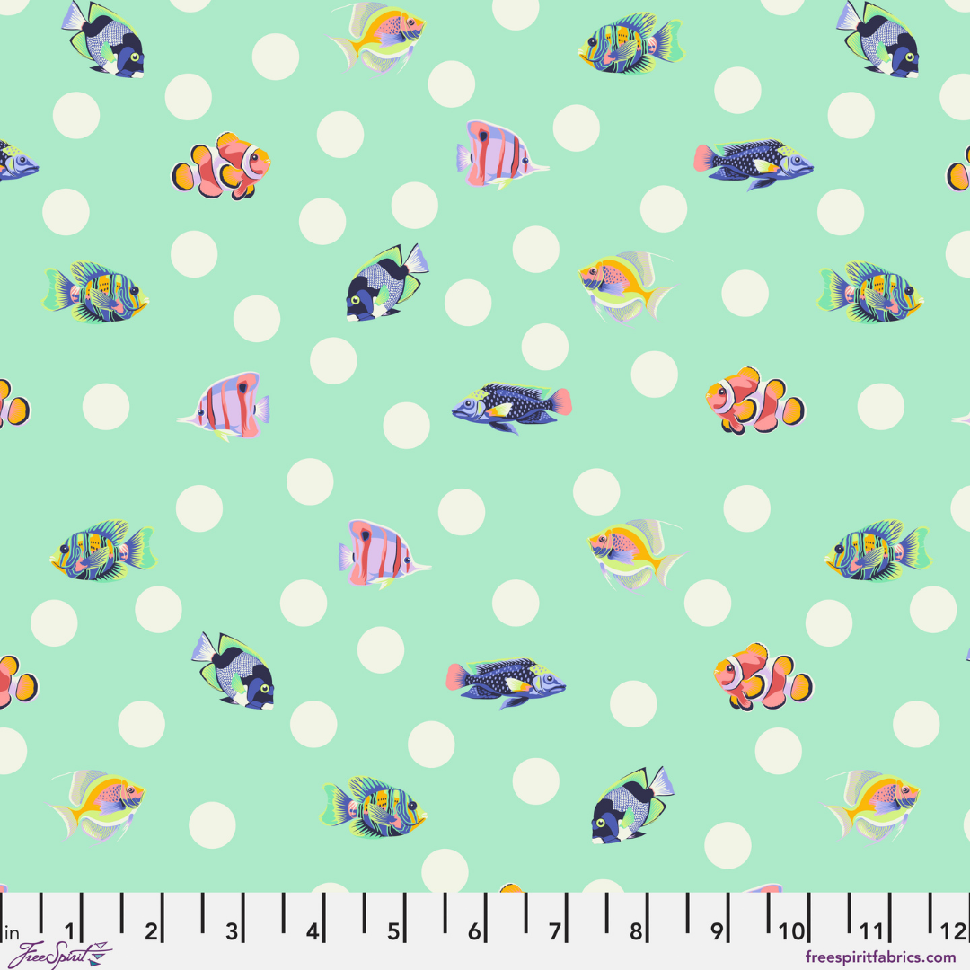 colorful fish on a mint ground with white dots