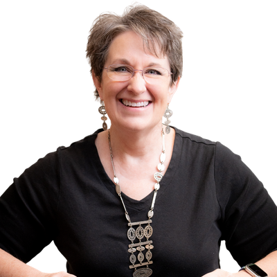 Woman wearing a black top with a decorative necklace on a white background